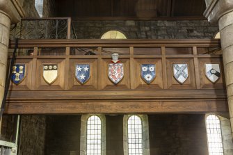 Detail of shields on gallery front.