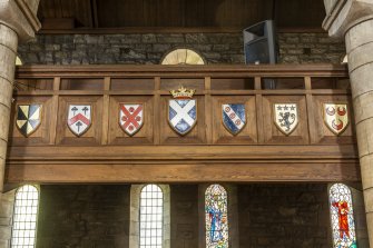 Detail of shields on gallery front.