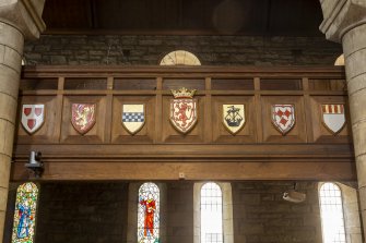 Detail of shields on gallery front.