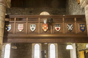 Detail of shields on gallery front.