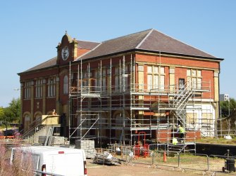 Site photograph, Station building with South elevation fire escape removed and scaffolding, Granton Gasworks, Edinburgh, Scotland