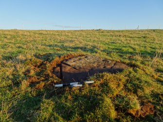 Digital photograph of panel in context with scale, from Scotland's Rock Art project, Hill Of Avochie, 2, Aberdeenshire
