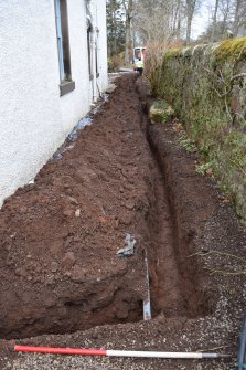 Watching Brief photograph, Trench showing ceramic water pipe at base of trench and blue modern water pipe 0.4m down, Knock Hill House, Glenbervie, Aberdeenshire
