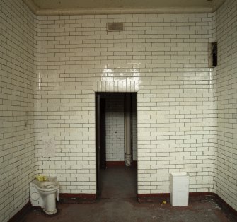 Cell Block. First floor Cell showing WC, ventilation grille and lighting recess with door open