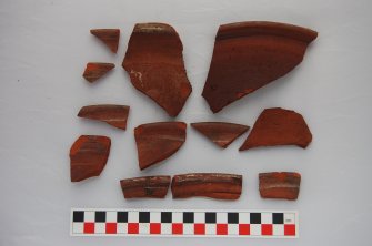 Watching Brief photograph, Cream glazed redware rim sherds from Trench 1 - reverse, 17-19 High Street, Fraserburgh
