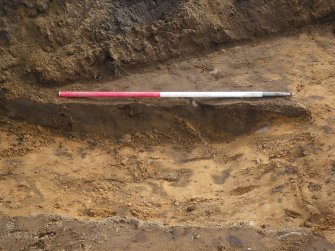 Evaluation photograph, NW facing section through linear feature (015), Ness Gap, Fortrose, Highland