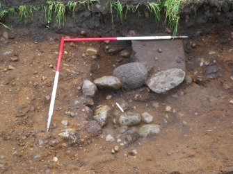 Evaluation photograph, Stone lined pit (019) and linear Feature [022], Ness Gap, Fortrose, Highland