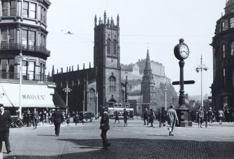  View of the West End of Princes Street, Edinburgh, looking towards the Castle,St John's Church, St Cuthbert's with pedestrians, tram etc