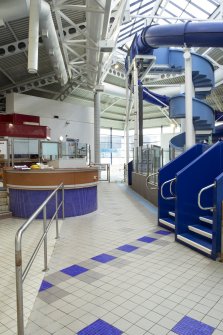 Xcite Livingston Leisure Centre.  View of pool area passageway, showing control desk and flume exits.