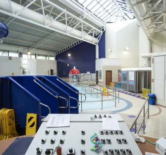 Xcite Livingston Leisure Centre.  View of pool area, showing control desk and flume exits.