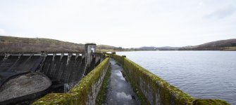 Carsfad Dam. East side of walkway, outlet needle valve house on left