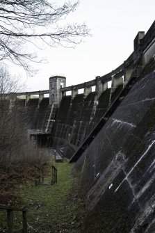 Carsfad Dam. Looking up towards outlet needle valve house from spillway area. Structure of this concrete dam clearly visible