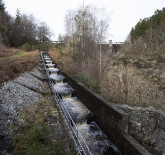 Carsfad Hydro Electric Power Station. Fish Ladder. View from south with dam and needle valve house beyond