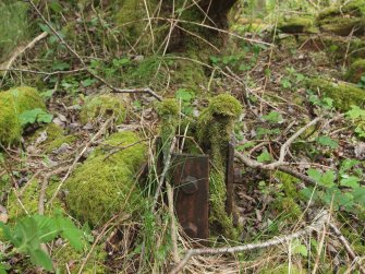 View of the foot of a steel sheathed wooden post on the SSW side of the Fan House