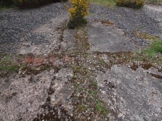 Detail of the brick foundations of the walls dividing up the interior