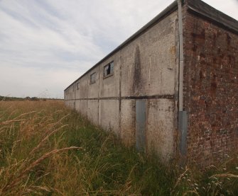 Explosives Magazine R24: a view of the NW corner of the building showing the character of the NNW elevation – 19.7.2022