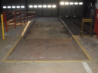View from the ENE of the loading bay at the WSW end of the platform within the main transit building (Y17)