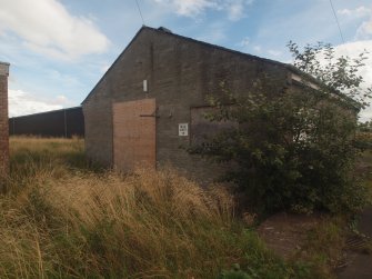 View from the ESE showing the façade of the office and store