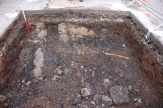 Watching Brief photograph, North facing section manhole 4 trench prior to insertion of pile shoring (Main Street from N), Campbeltown Flood Relief Sewer, Argyll and Bute