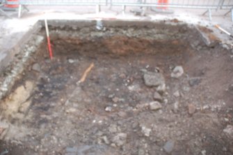 Watching Brief photograph, East facing section manhole 4 trench prior to insertion of pile shoring (Main Street from E), Campbeltown Flood Relief Sewer, Argyll and Bute