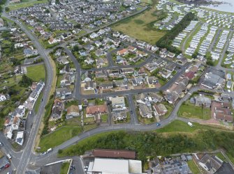 Oblique aerial view from east showing Mid- to Late C20 (Barefoots), Mid- to Late C20 (Deanhead) and Recreation (Holiday Park) Areas of Townscape Character, Eyemouth