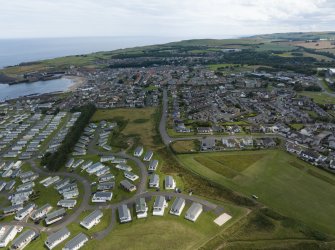 Oblique aerial view from north-west showing Recreation (Holiday Park), Mid- to Late C20 (Barefoots) and Mid- to Late C20 (Deanhead) Areas of Townscape Character, Eyemouth