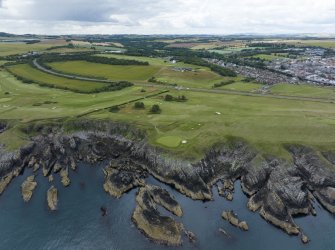 Oblique aerial view from east showing Recreation (Golf Course) and Modern (Gunsgreenhill) Areas of Townscape Character, Eyemouth