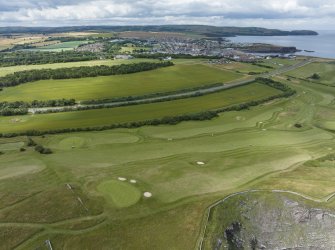 Oblique aerial view from east showing Recreation (Golf Course) and area for proposed development in Modern (Gunsgreenhill) Areas of Townscape Character, Eyemouth