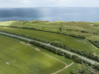 Oblique aerial view from south-west showing Recreation (Golf Course) and area for proposed development in Modern (Gunsgreenhill) Areas of Townscape Character, Eyemouth