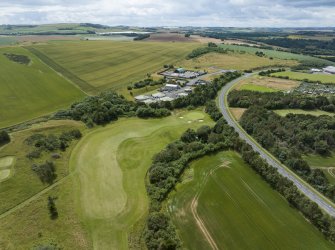 Oblique aerial view from north-north-east showing Recreation (Golf Course) and Industrial (Gunsgreenhill Industrial Estate) Areas of Townscape Character, Eyemouth