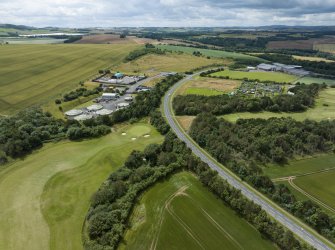 Oblique aerial view from north-north-east showing Recreation (Golf Course) and Industrial (Gunsgreenhill Industrial Estate) Areas of Townscape Character, Eyemouth