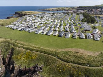 Oblique aerial view from north-west showing Recreation (Holiday Park) Area of Townscape Character, Eyemouth