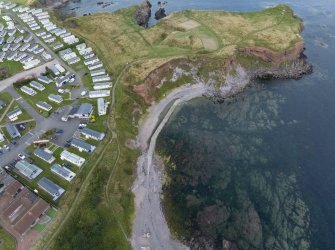 Oblique aerial view from south showing Eyemouth Fort, Eyemouth Battery and Recreation (Holiday Park) Area of Townscape Character, Eyemouth