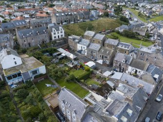 Oblique aerial view from north-east showing Historic Burgh and Harbour, Victorian Expansion and Inter-War (Hurkur Crescent and Schools) Areas of Townscape Character, Eyemouth