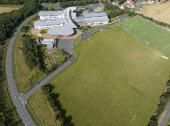 Oblique aerial view from north-east showing Modern (Gunsgreenhill) Area of Townscape Character, Eyemouth