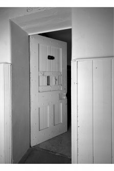 Interior - rear block, detail of door to cell