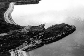 View down onto Dun Canna fort from higher ground.