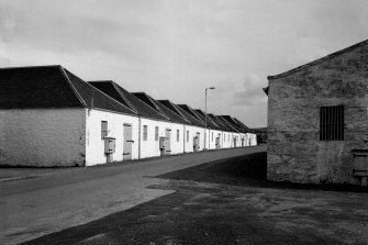 Distillery, Port Ellen.
View of range of bonded warehouses from West.