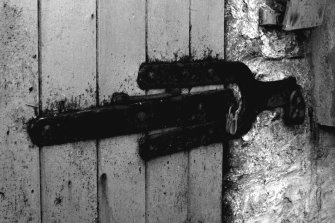 Bonded Warehouse, Lochindaal Distillery, Port Charlotte.
Detail of specimen strap-hinge door with 'shrouded' forked hasp-lock.