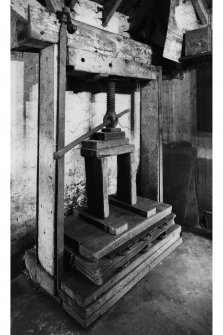 Redhouses Woolen Mill, Islay.
Detail of cloth press, showing a folded batch (chess) of cloth in position between hot-plates.