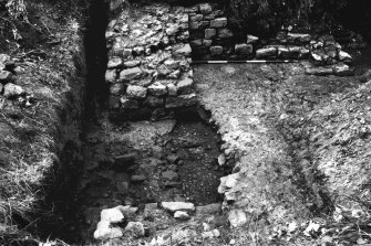 Excavation photograph showing the E wall at the NE angle, from the fort.