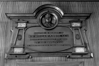 Detail of the plaque commemorating the life of Sir William Arrol, situated in the foyer of the offices of the Dalmarnock Ironworks, Glasgow