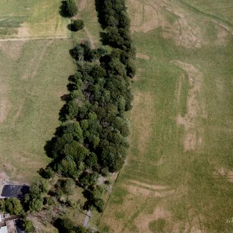 Oblique aerial view of Castledykes Roman Fort and annexes.