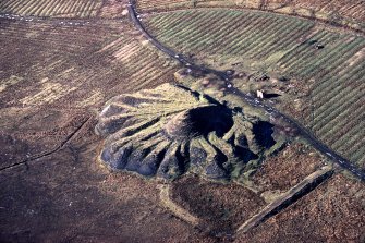 Oblique aerial view of Lochend Colliery pit no.5, taken form the ESE. The bing from the pit overlies rig cultivation.