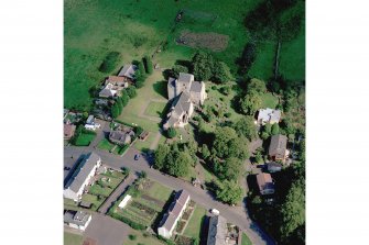 Oblique aerial view of Torphichen Preceptory. The central part of the medieval church, comprising the 13th century tower and the N and S trancepts, survives. The present parish church, built in 1756, overlies the foundations of the medieval nave.