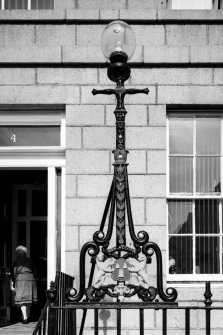 Aberdeen, 4 Golden Square.
Detail of cast iron lamp standard incorporated in railings outside no.4 Golden Square.