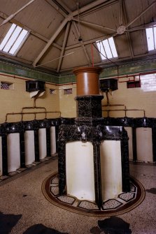 Rothesay West Pier. General view of Gentleman's toilet, with black marble glazed clay island urinal block.