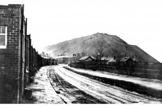 Copy of postcard showing general view of Oakbank village and bing at shale-oil works.  Insc. "Oakbank".