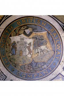 Mosaic in the Booking Hall at Waverley Station, Edinburgh, with the North British Railway Crest in the north east angle.