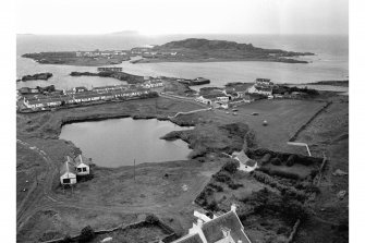 Easdale Island, Slate-quarries and worker's dwellings (background) with Ellanabeich quarries and houses in the foreground. General view of slate quarries and workers' houses from North-East.
